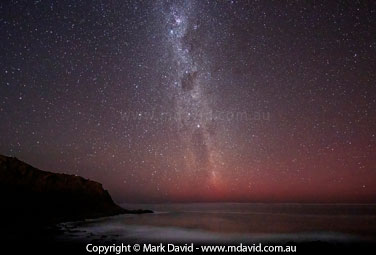 Milky Way shining through an aurora